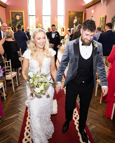 Groom and bride walking down the aisle at irish luxury castle wedding