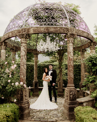 Newlywed couple stand inside garden pavillion at ballyseeded country estate and castle