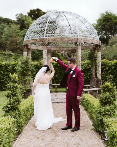 Couple dances in the estate gardens at ballyseede castle wedding venue