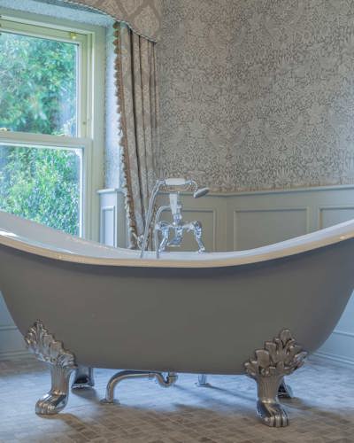 Luxury bathroom with bath in castle hotel in kerry ireland
