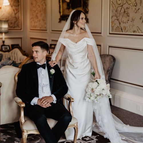 Bride and groom pose for photos inside ballyseede castle estate in kerry
