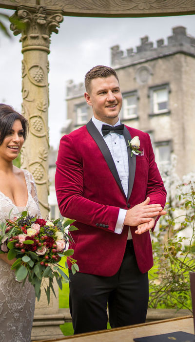 Couple stand at the altar on their wedding day at ballyseede castle wedding venue