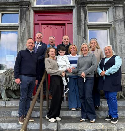 Ballyseede castle staff posing for photo outside hotel