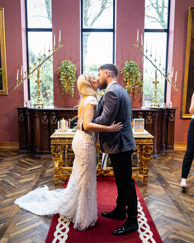 First kiss at the altar in the ballyseede castle wedding chapel in kerry
