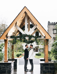 Couple embrace at Ballyseede castle on their wedding day