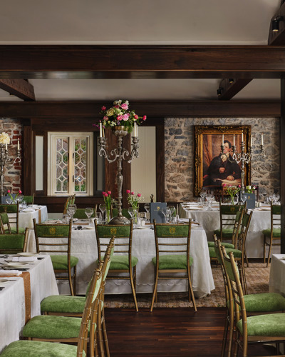Tables set up for dining reception at castle estate wedding venue ireland