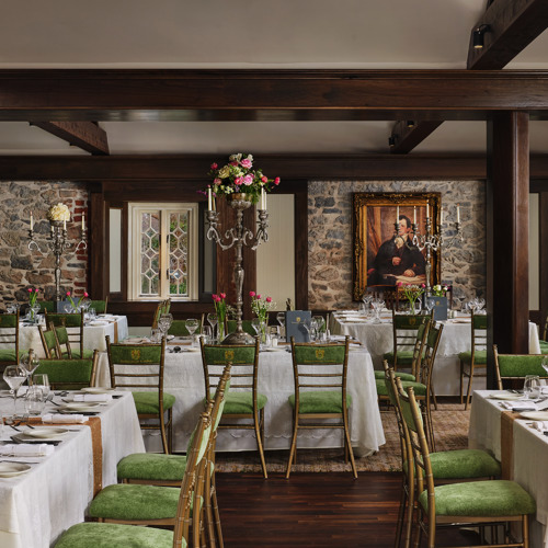 Tables set up for dining reception at castle estate wedding venue ireland