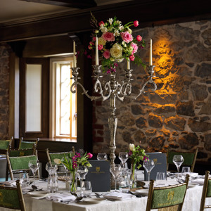 Large silver candlestick holdere on wedding reception table in irish wedding venue