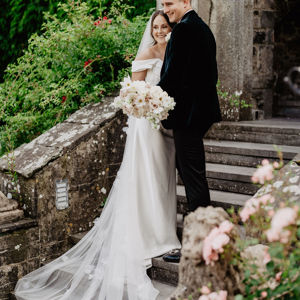 Couple smile for photos on their wedding day at irish castle
