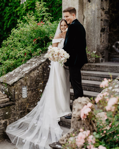 Couple smile for photos on their wedding day at irish castle