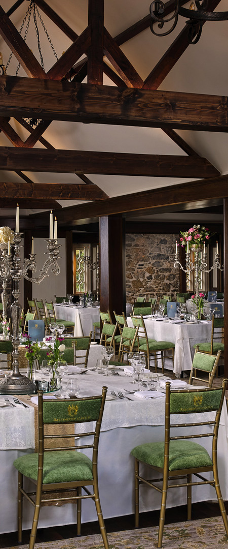 Hotel wedding reception hall on country estate with high ceilings and timber beams
