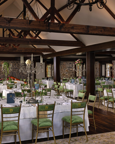 Hotel wedding reception hall on country estate with high ceilings and timber beams